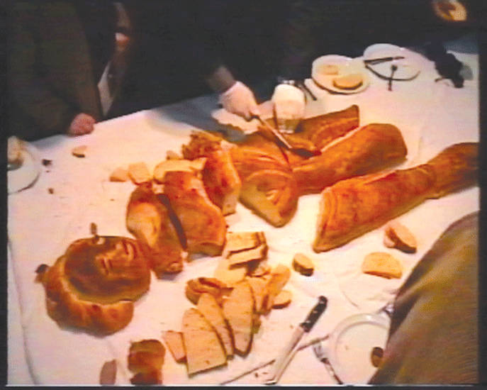    "On the Table". 2002.  Installation.  Bread, table, plates, glasses, cutlery.  Artists house, Tel Aviv.  Video from performance.  